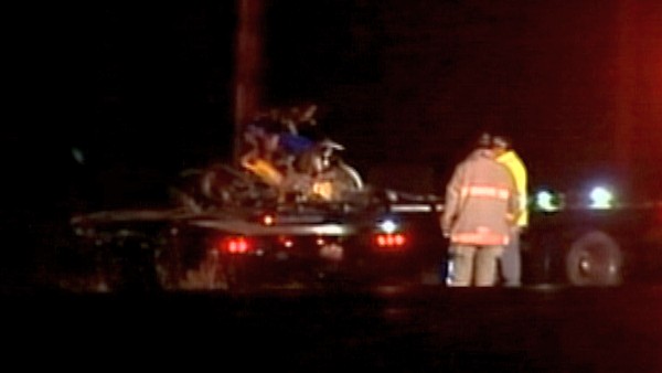 Fire crews inspect a fatal crash scene; December 4, 2012