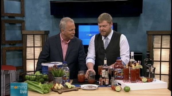 Clint Pattemore (r) shows Bob Cowan how to make summer caesars; Morning Live, June 25, 2013