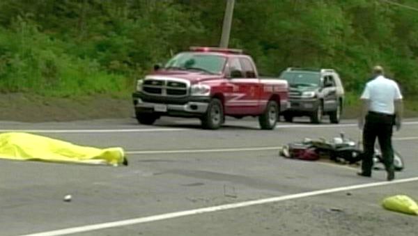 Investigators at the scene of a fatal motorcycle collision, Dominion Rd, Fort Erie, July 2, 2013