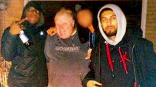 Anthony Smith, Rob Ford, Muhammad Khattak outside a home near a Dixon Road housing complex