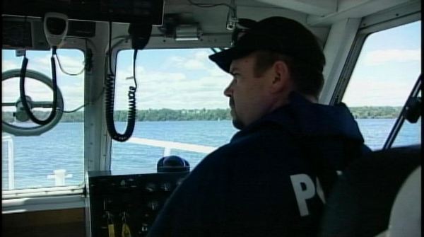 A Hamilton Police officer patrols the harbour; July 25, 2013