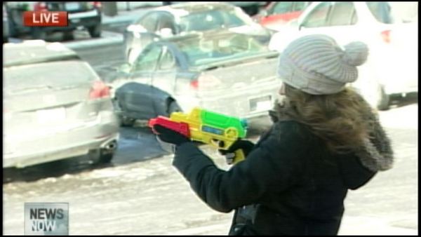 Shelly Marriage takes aim with a super soaker loaded with hot water; January 7, 2014