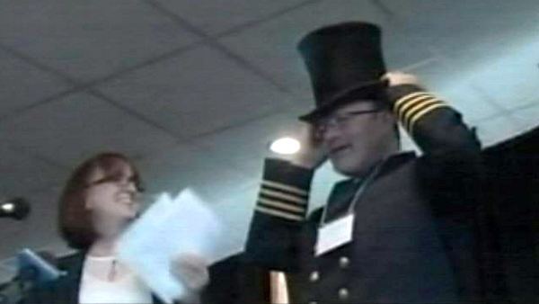 The captain of the Algoma Equinox is presented with a top hat at the Welland Canal's opening ceremony; March 28, 2014