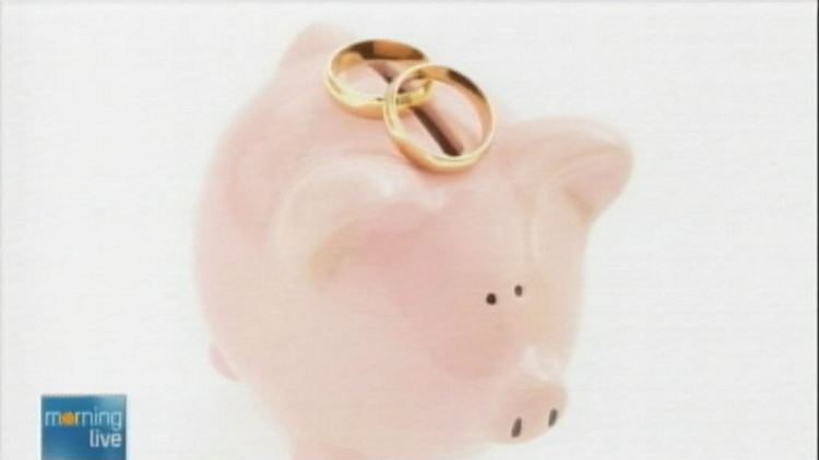 Wedding rings on a piggy bank