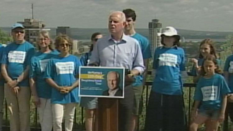 Hamilton mayoral candidate Brian McHattie flanked by supporters; July 2, 2014