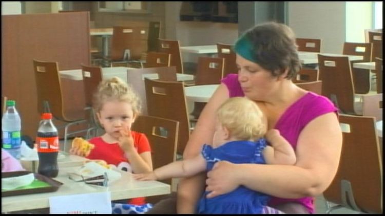 Just two days after a Hamilton woman was told to cover up while breastfeeding in a public place, dozens of fellow mothers gathered this morning to breastfeed in the same location to show their support.