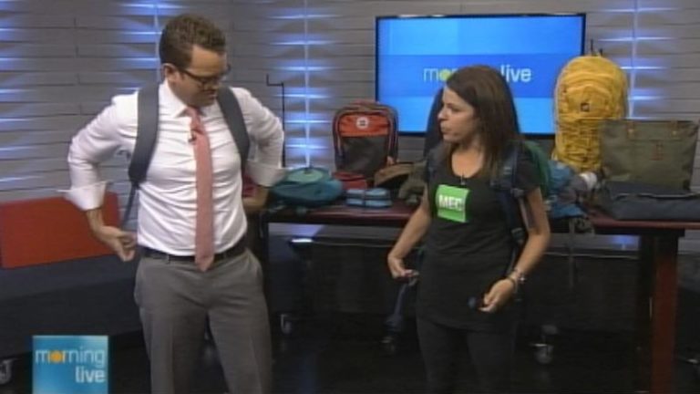 Tim Bolen and Kaylyn Stucliffe try on backpacks from MEC; Morning Live, August 7, 2014