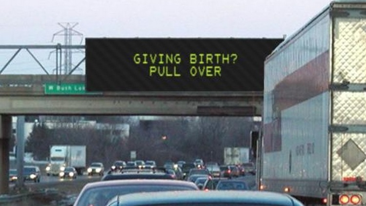 Illustration of highway sign saying 'Giving birth? Pull over'. From sign generator at atom.smasher.org