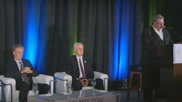 Hamilton mayoral candidates Fred Eisenberger & Brian McHattie with moderator Bill Kelly (standing); September 18, 2014