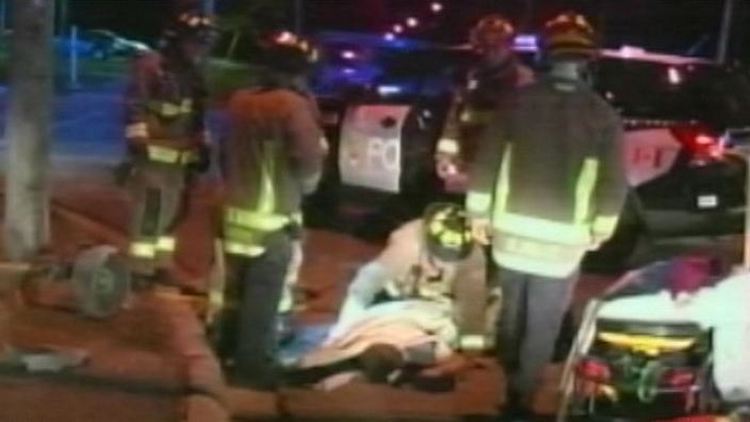 Firefighters attend to a man rescued from a hole in Niagara Falls; September 22, 2014