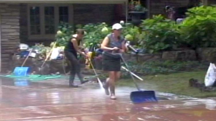 Homeowners clean up after flooding; Burlington, August 2014