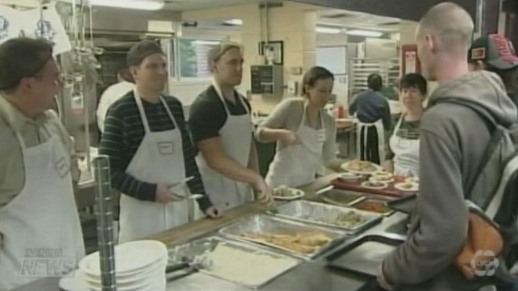 Volunteers serve Thanksgiving dinner at the Good Shepherd Centre