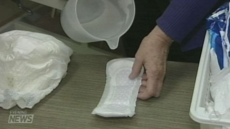 Water being poured into a sanitary pad