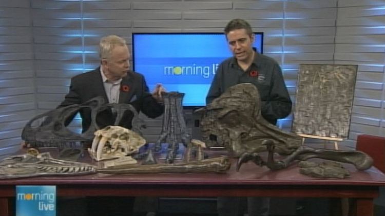 Bob Cowan with Club Rex's Alex Nelson and the bones of a spinosaurus; Morning Live, November 4, 2014