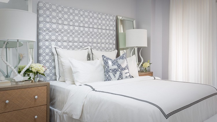 A bedroom designed by Jo Alcorn using linens and pillows from Whitewash & Co