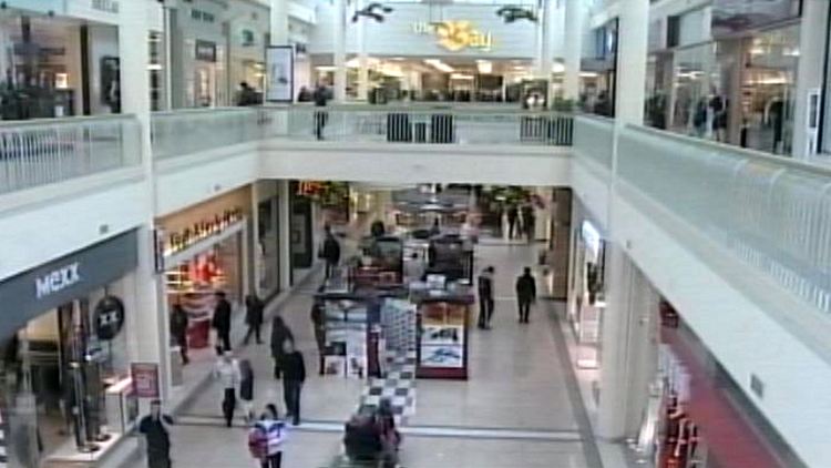 Archival image of a shopping mall with shoppers