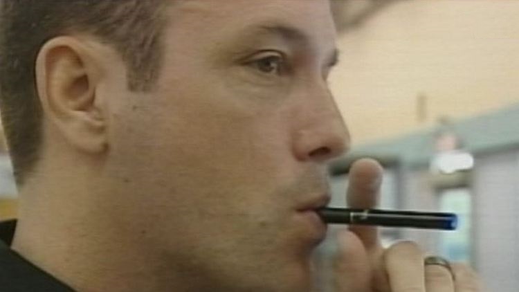 Archive image of a man using an e-cigarette