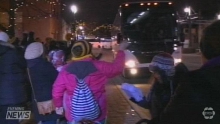 Fans greet the Tiger-Cats on their return to the Jarvis Street offices tonight