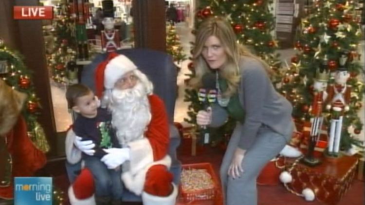 Jaclyn Colville with Santa & child; Morning Live, December 24, 2014