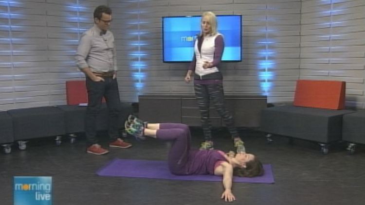 Tim Bolen and Heather Gardner of Run, Soul, Cycle check out a model's exercise; Morning Live, January 2, 2015