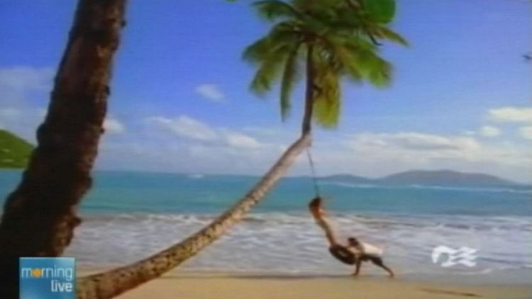 Image of an older couple playing on a tropical beach (supplied)