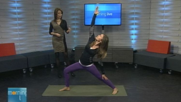 Lesley Stewart watches as holistic health coach Gillian Brown gets in a yoga pose; Morning Live, January 26, 2015