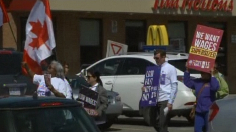 Protestors outside McDonald's at Dundurn & Main in Hamilton, April 15, 2015