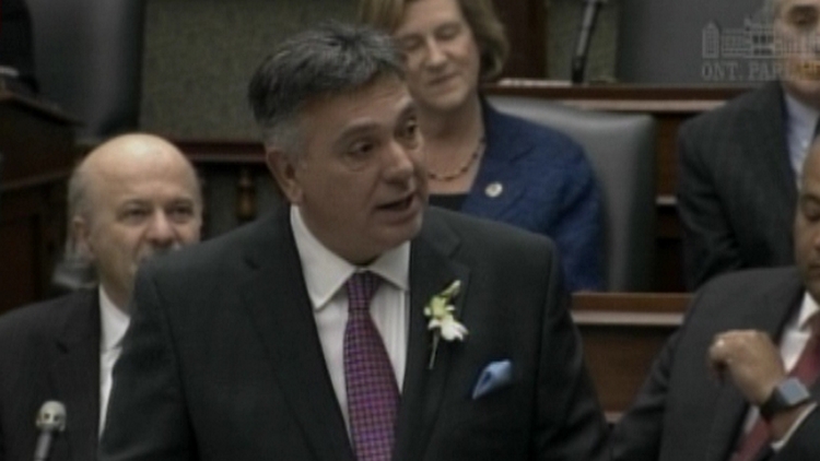 Charles Sousa tabling the 2015 Ontario budget in the legislature; April 23, 2015