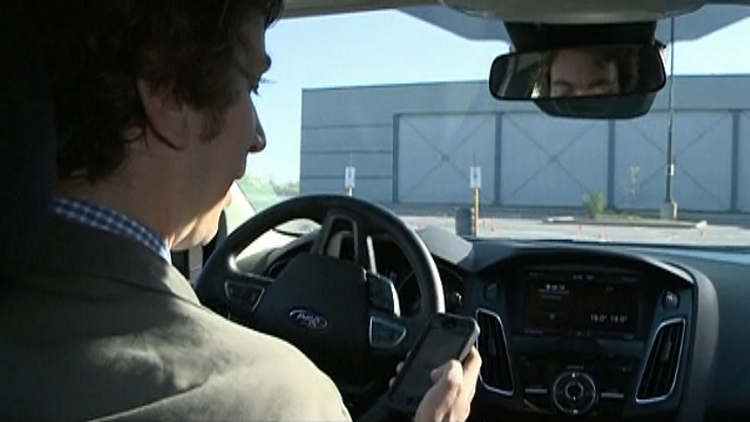 CHCH's David Brennan tries texting and driving; Brampton, May 7, 2015