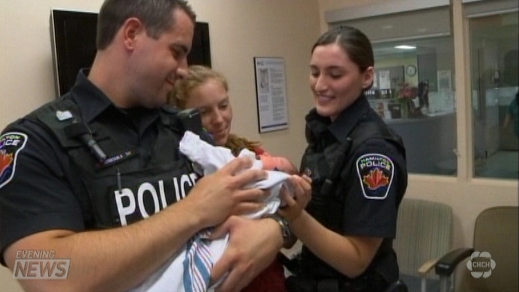 Police officers deliver baby