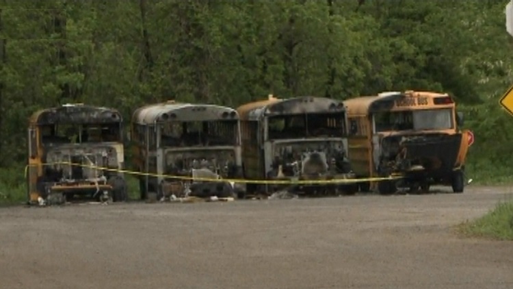 Four school buses destroyed by fire in FirstStudent yard; Burlington, June 1, 2015