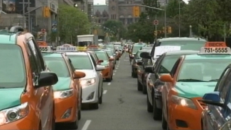 Co-Op cabs lined up along University Ave in Toronto; June 1, 2015