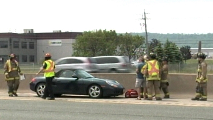 A Porsche hit by a flying tire; Grimsby, June 10, 2015