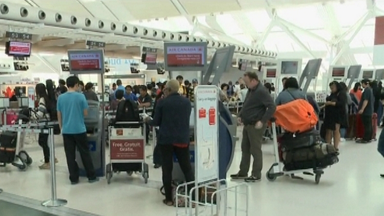 Fliers at Air Canada counter at Pearson Airport, July 3, 2015