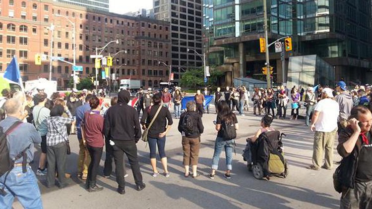 Protestors outside the Climate Summit of the Americas; Toronto, July 8, 2015