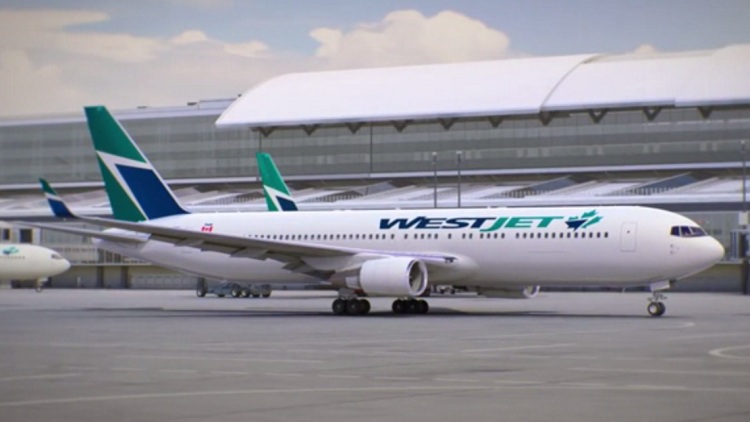 Westjet plane showing new maple leaf logo