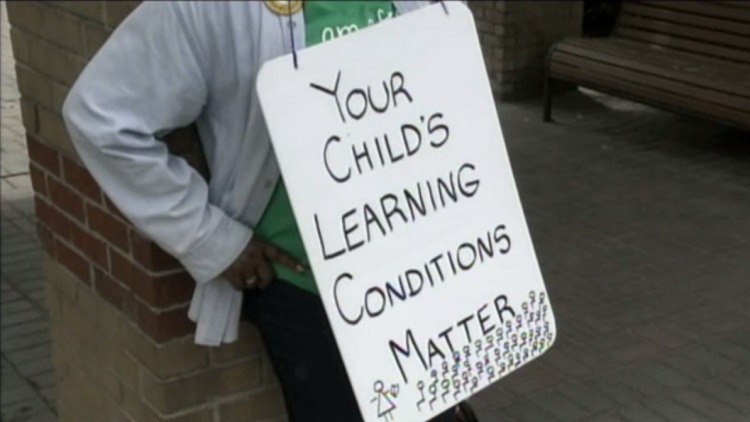 A teacher's protest sign