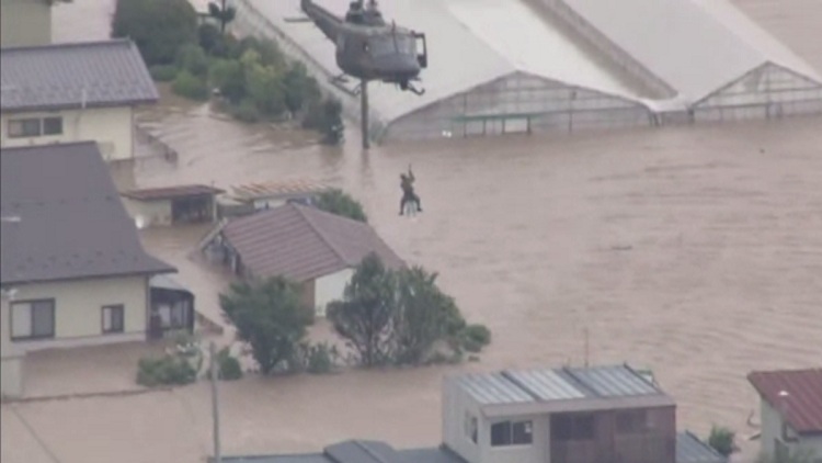 Rooftop rescues in flooded Japan