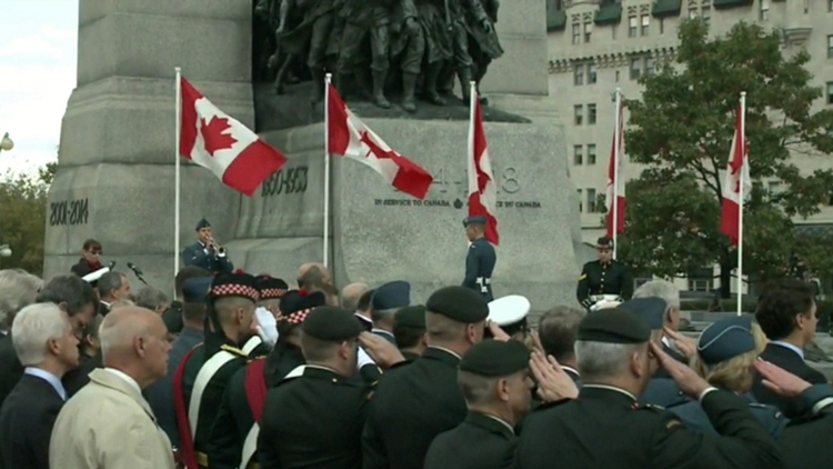 Soldiers offer a salute at ceremony marking events of October 22, 2014; Ottawa, October 22, 2015