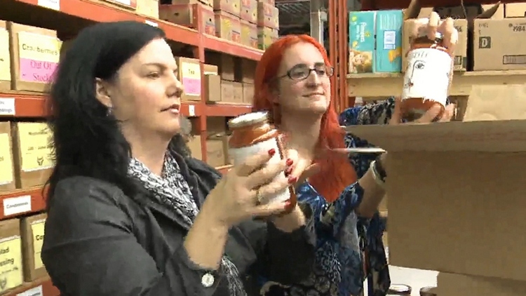 Elaine Douglas (r), sorting through $10,000 of pasta sauce; Grimsby, October 27, 2015