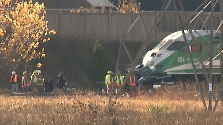 Investigators at the scene of a collision between a GO train and a tow truck; Milton, October 30, 2015