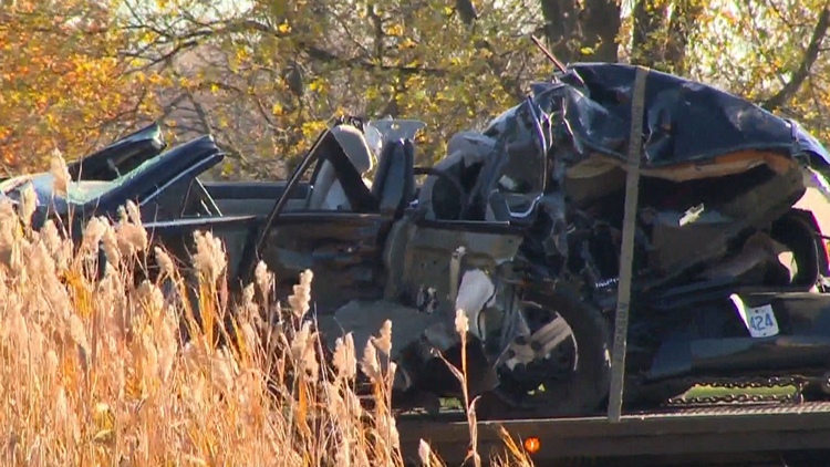 The wreckage of a car is removed after a collision with a tractor-trailer; Fort Erie, November 3, 2015