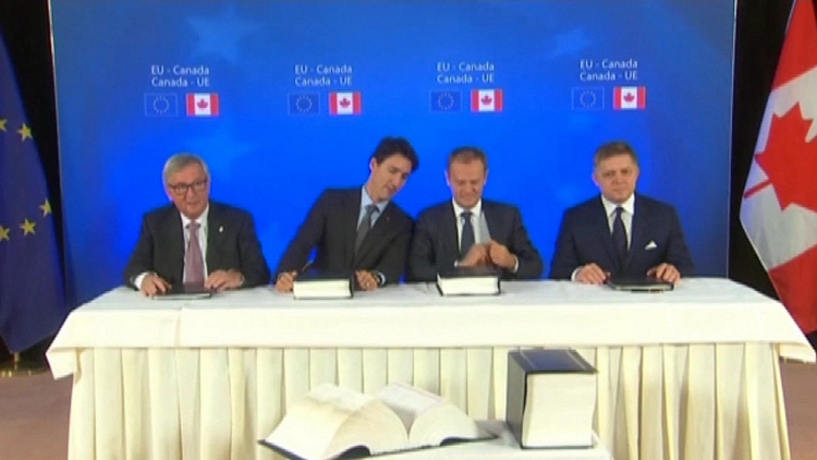 Trudeau signs free trade deal with European Union amid CETA protests