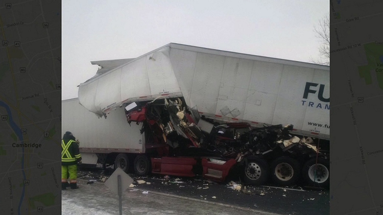 Two transport truck collision closes down Highway 401 in Cambridge