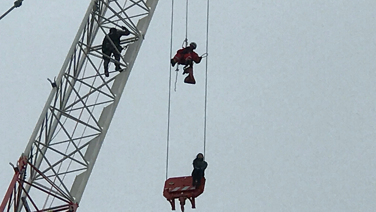 Woman rescued from crane faces six charges