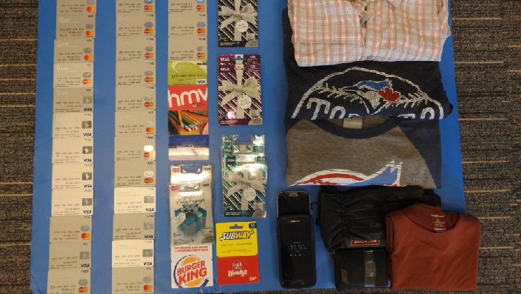 Two people charged after police seize $2500 worth of pre-paid credit cards