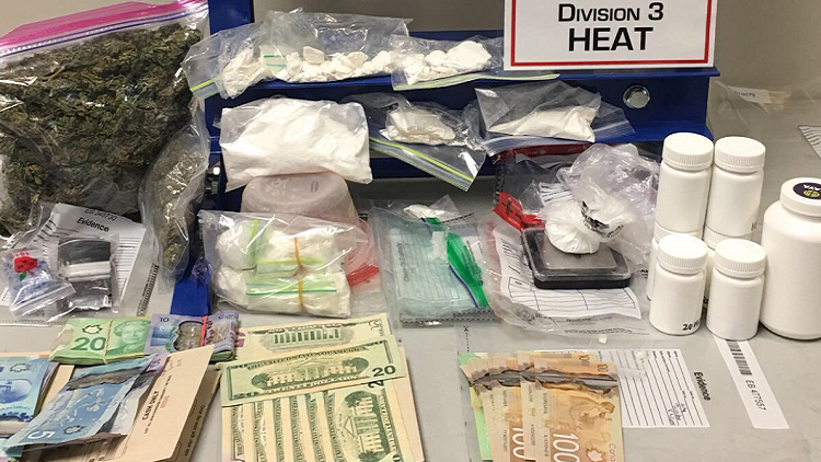 Cocaine press, cash and $90K worth of drugs seized in Hamilton