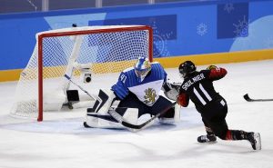 Jillian Saulnier (11), of Canada, scores a goal against goalie Noora Raty (41), of Finland, during the second period of the preliminary round of the women's hockey game at the 2018 Winter Olympics in Gangneung, South Korea, Tuesday, Feb. 13, 2018. (AP Photo/Frank Franklin II)