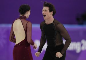 Tessa Virtue and Scott Moir of Canada react after their performance in the ice dance, free dance figure skating final in the Gangneung Ice Arena at the 2018 Winter Olympics in Gangneung, South Korea, Tuesday, Feb. 20, 2018. (AP Photo/Julie Jacobson)