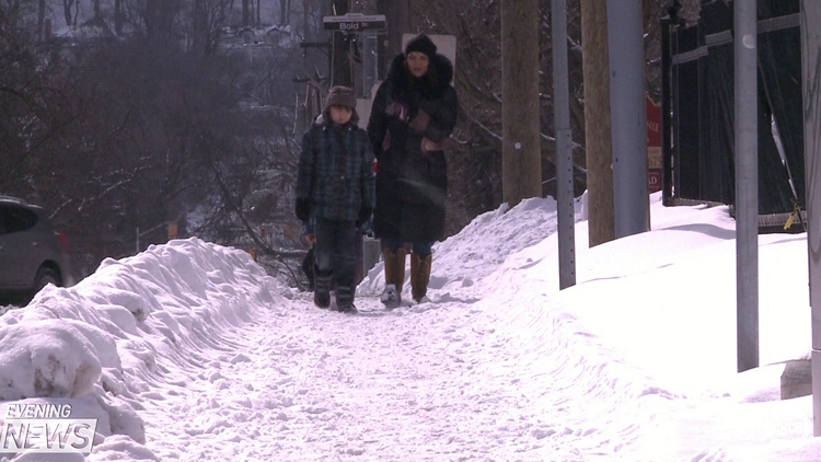 Icy and snow covered sidewalks in Hamilton